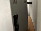 a small refrigerator that is sitting on a wooden table