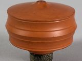 an image of a clay pot with a lid