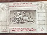 plaque depicting a baby sleeping in a niche with an angel on it