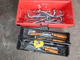 a red box with tools in it on the floor
