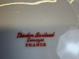 a white plate with a red inscription on it