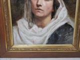 painting of a woman in a white head scarf in a gold frame