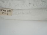 a close up of a white vase with a label on it