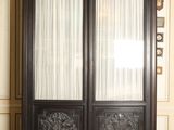 a large black cabinet with two doors in a room