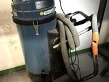 a dust collector and a vacuum in a garage
