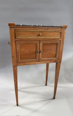 a small wooden table with a marble top on it