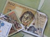 a picture of a painting of a man on a pile of money