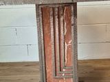 a wooden table with a clock on it on a wooden floor