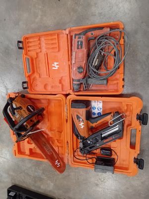 two orange tool cases with tools in them sitting on the floor