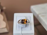 a ring that is sitting in a box on a table