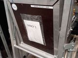 a metal ladder with a sign on it in a warehouse