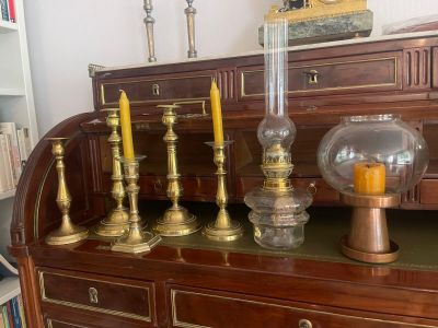 a lot of candles that are sitting on top of a dresser