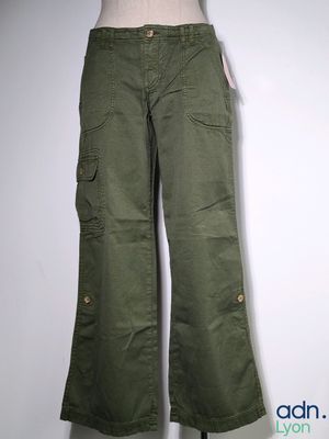 an image of a woman ' s green pants hanging on a wall