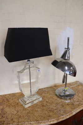 a lamp that is sitting on a table next to a lamp