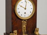 a clock that is sitting on top of a table