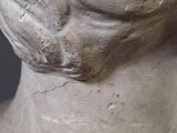 a close up of a sculpture of a woman ' s head