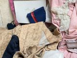 a pile of clothing that is sitting on the floor