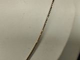 a close up of a necklace on a mannequin neck
