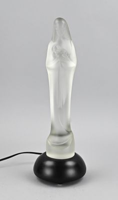 an image of a glass figurine on a black base