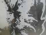 a picture of a person holding an umbrella in the rain