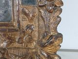 a picture of a gold frame with flowers and leaves