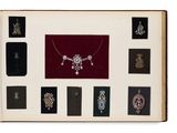 an open book with many different types of jewelry on it