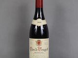 a bottle of wine that is sitting on a table