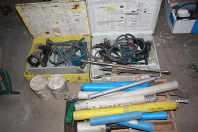 a box full of tools that are sitting on the floor