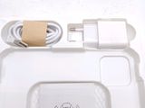 a white tray with a charger and a charger attached to it