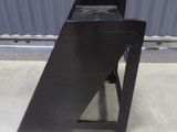 a black table that has a metal frame on it