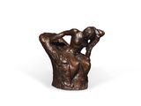 a bronze statue of a man holding his head in his hands