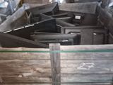 a pile of metal and wood items in a room