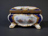 a blue and white box with a painting on it