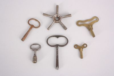 many different types of keys on a white surface
