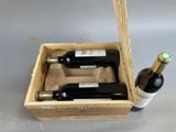 two bottles of wine in a wooden box