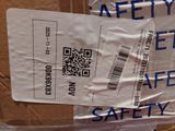 a package of safety labels on a cardboard box
