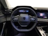 the interior of a car with a steering wheel and dashboard controls
