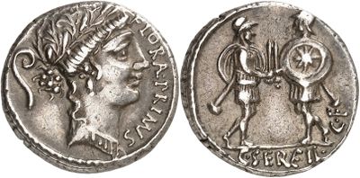 a silver coin with an image of a man holding a sword