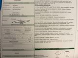 une feuille de papier sur laquelle figure la photo d'une personne et son nom