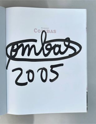 a picture of a book with a picture of the olympics logo on it