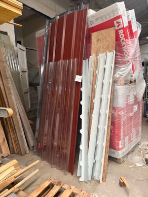 several pieces of wood are stacked up in a warehouse