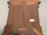 a wooden clock that is sitting on a table