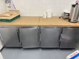 a kitchen with stainless steel cabinets and a counter top