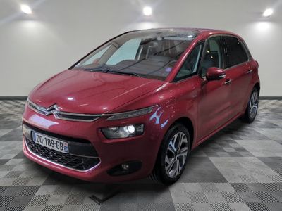 the red citrole is parked on a checkered floor