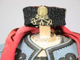 a close up of a hat and jacket on a mannequin