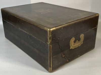 a small wooden box with a chain around it