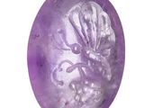 lavender colored soap with an octopus in the middle on a white background