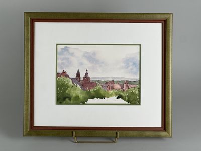 framed watercolor painting of a view of a town with a church
