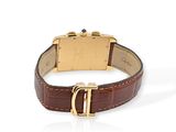 an image of a gold watch with a brown leather strap