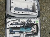 a tool in the case that is sitting on the ground